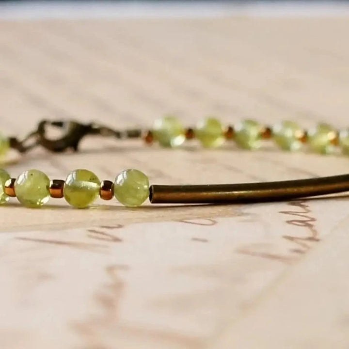 Natural peridot beads, bronze bar bracelet